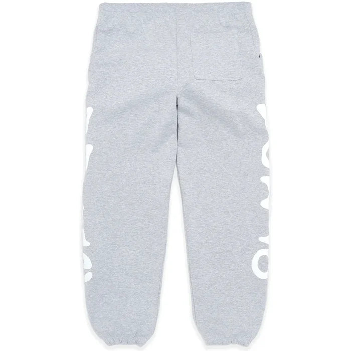 100% Cotton Sp5der Sweatpants for Men – Grey streetwear jogger pants featuring a relaxed fit, elastic waistband and cuffs, right back pocket, and bold white graphic print down both outer legs.
