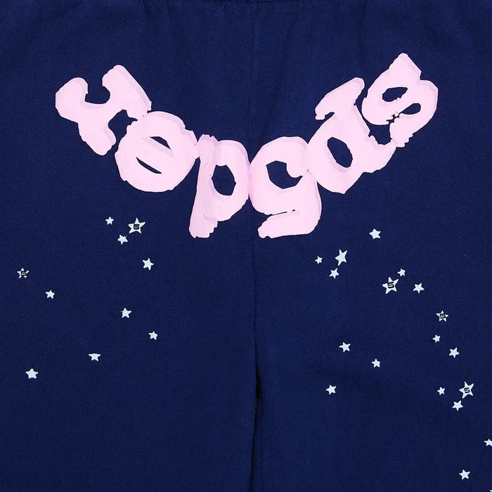 These unisex navy blue Sp5der sweatpants are made from 100% cotton, featuring a pink logo and star graphics in a relaxed fit—ideal jogger pants for streetwear style.