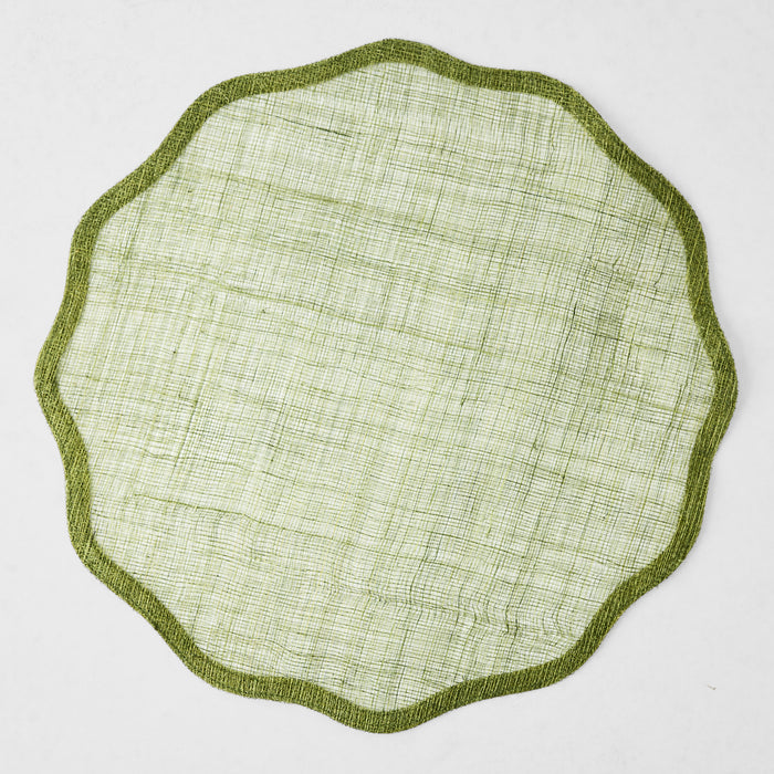 16-inch round aloe green abaca placemat with a semi-transparent woven texture and a solid scalloped border.