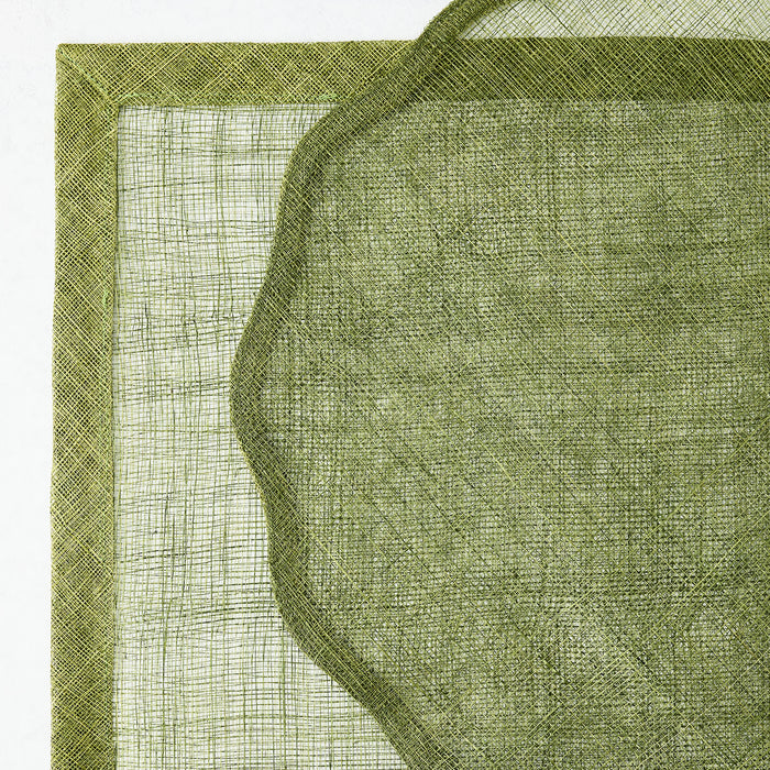 Aloe green 16-inch round abaca placemat with a semi-transparent mesh texture and a solid scalloped border.