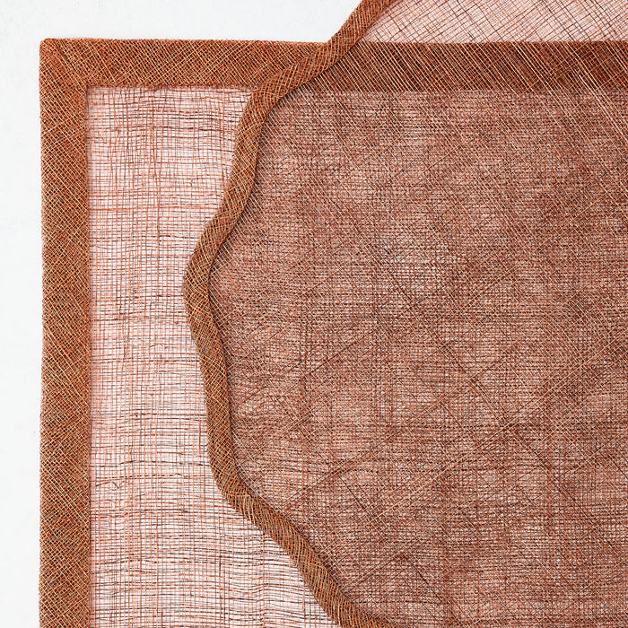 Brick red square abaca fiber placemat with a semi-transparent mesh center and solid woven border.