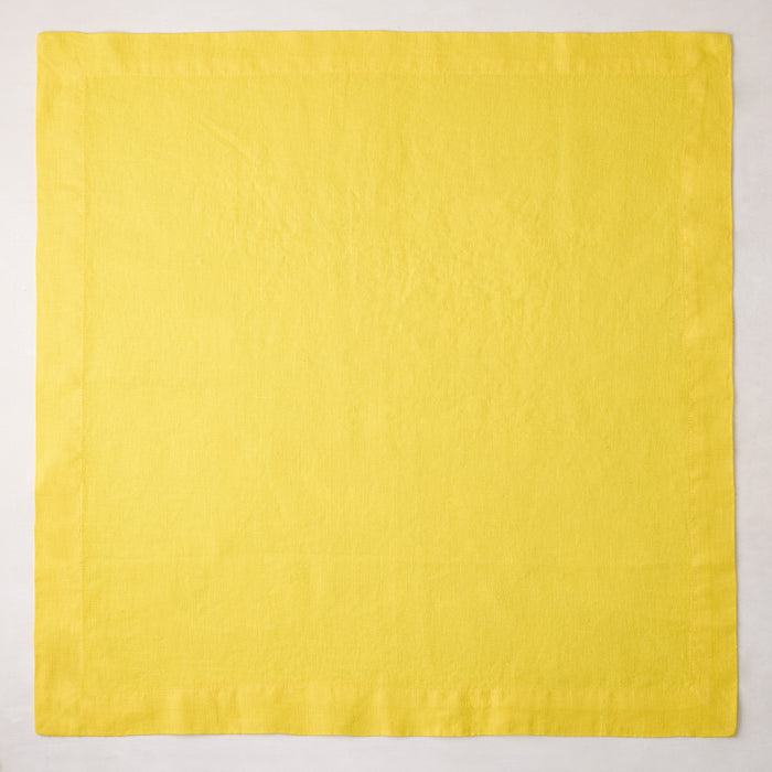 Canary HG Signature hand-dyed 22-inch square linen napkin, bright buttery yellow with mitered corners.