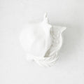 Handmade white glazed ceramic pomegranate decorative sculpture with artisanal details, 11 inches long.