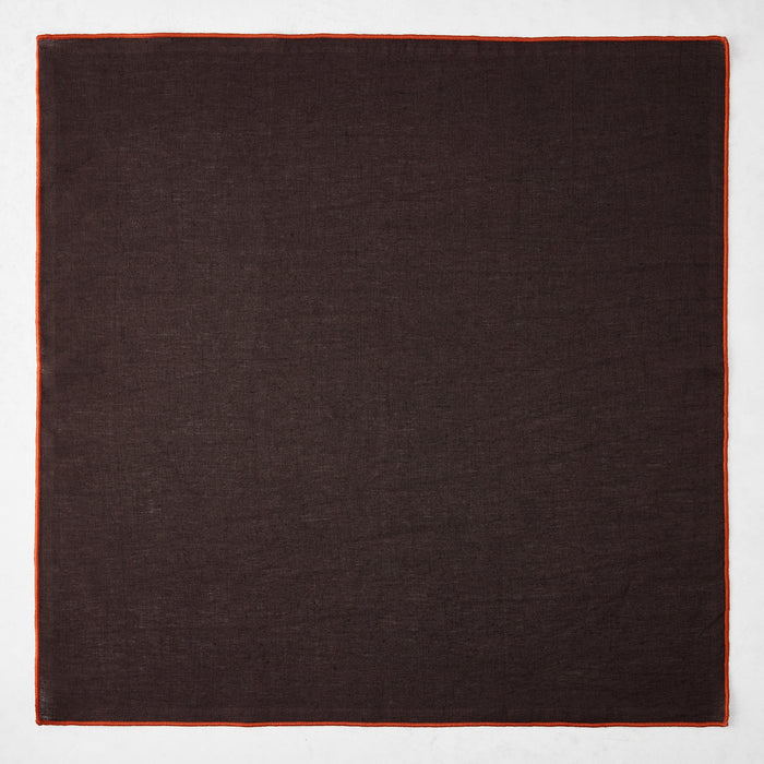 22-inch square chocolate brown linen napkin with a contrasting brick red embroidered tipped stitch edge.