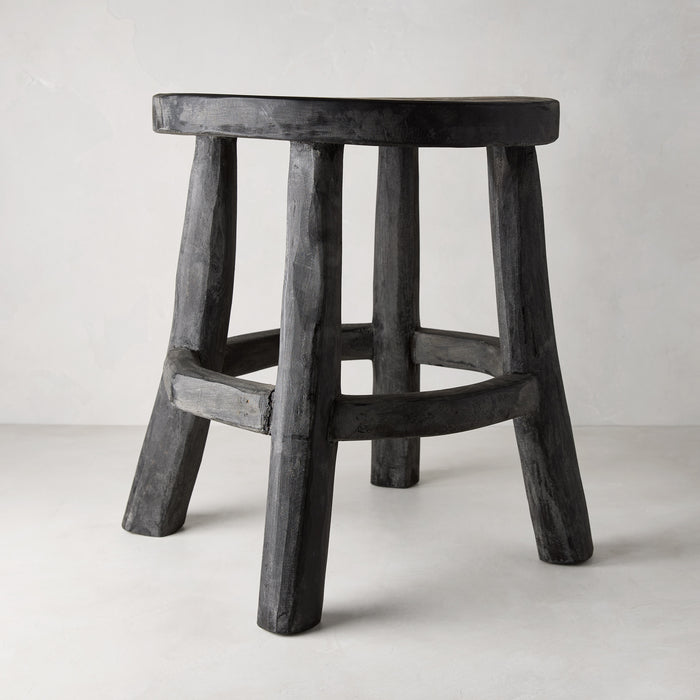 Diane Keaton + Hudson Grace black reclaimed teak wood stool with rustic texture.