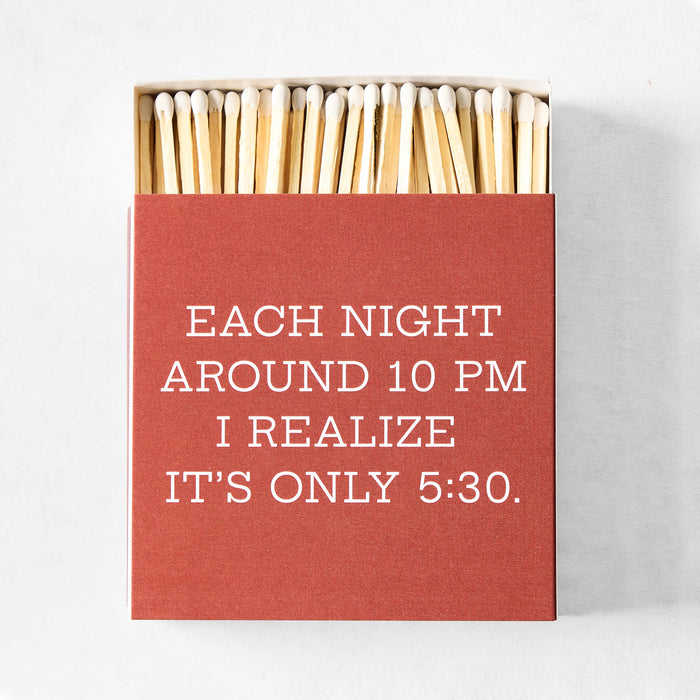 Open box of 4-inch oversized matches with a red cover featuring white text reading Each Night Around 10pm.