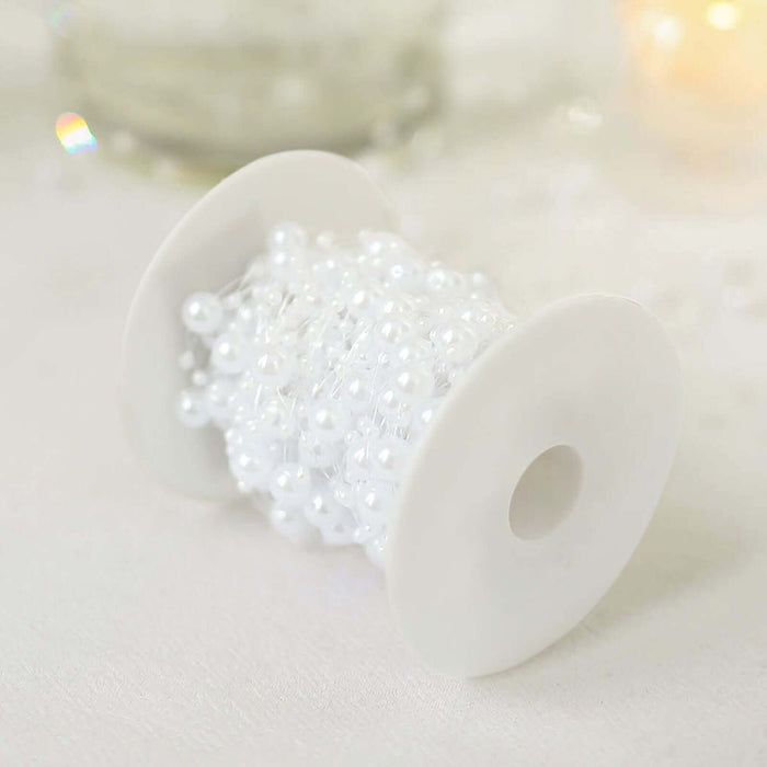 White pearl bead spool on a plain white background