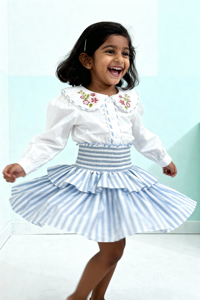 Capri Blouse and Amalfi Skort set styled on child showing coordinated outfit fit