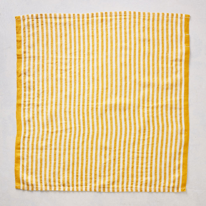 21-inch square linen napkin with golden yellow ticking stripes on a white base and a solid yellow border.
