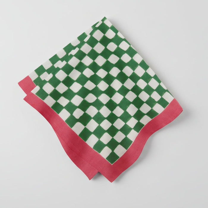 Green and white check cotton napkin with a pink border, folded.