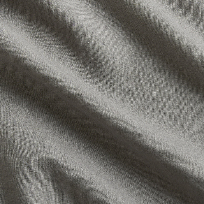Grey Washed-Linen Pillow Sham fabric swatch with subtle wrinkles and texture.