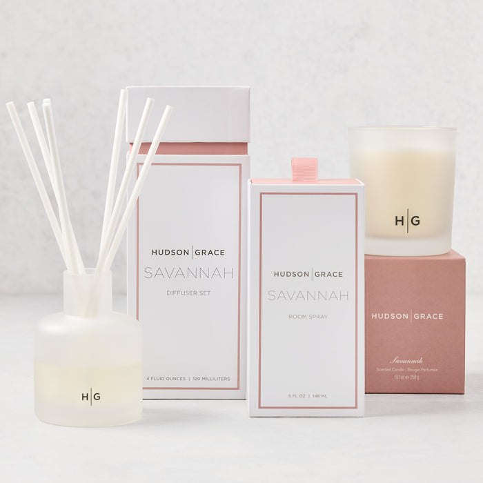 Hudson Grace Savannah Scent Gift Set: white candle, diffuser with reeds, and room spray in elegant packaging.