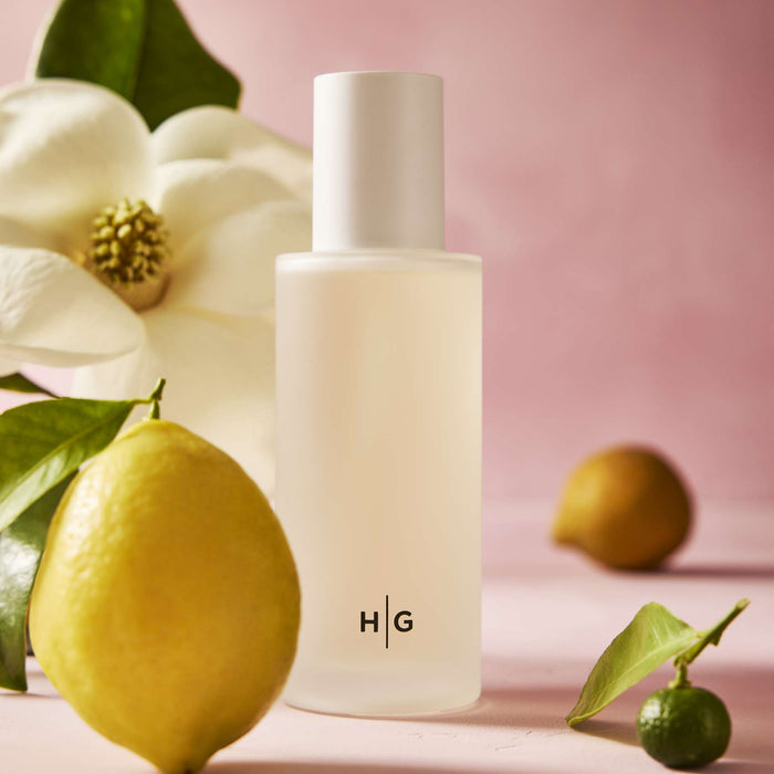Hudson Grace Savannah Scent Room Spray, frosted glass bottle with HG logo, lemon, lime, and magnolia flower.