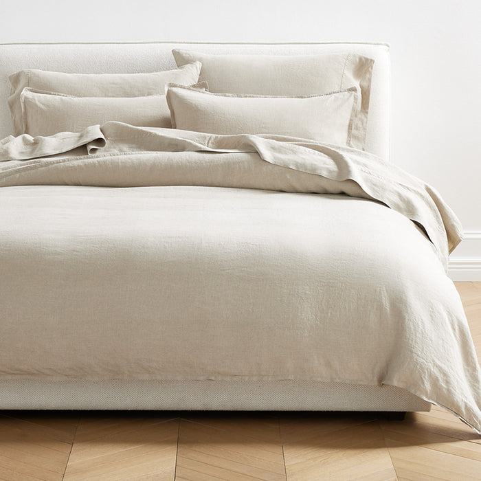 Khaki Washed-Linen Pillowcases and bedding set on a bed, showing soft texture and relaxed style.