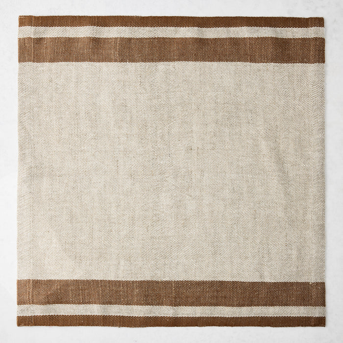 Lexington Tobacco Brown Stripe Border Napkin, natural linen-cotton blend, 20" square.