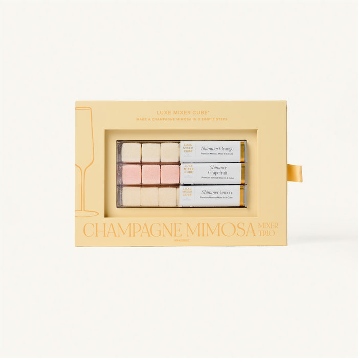 Luxe Champagne Mimosa Mixer Cube Trio: 18 shimmering orange, grapefruit, and lemon flavored cubes in a beige box.