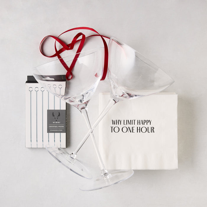 Martini Party Gift Set with two clear mouth-blown glasses, stainless steel cocktail picks, and witty paper napkins.