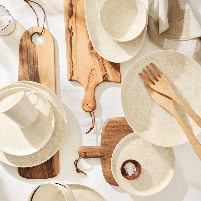 8.25-inch cream stoneware salad plate with beige splatter pattern, handcrafted in Portugal.