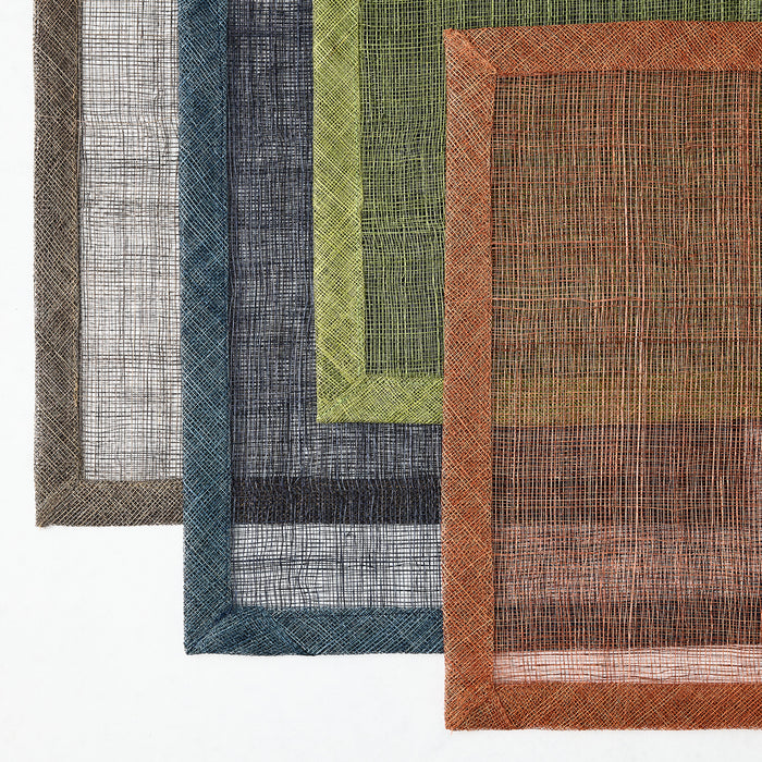 Set of square Abaca fiber placemats in assorted colors with semi-transparent woven centers and solid borders.