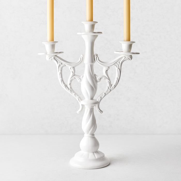 Orvieto white ceramic three-arm candelabra with ornate vintage Italian design and tapered candles.