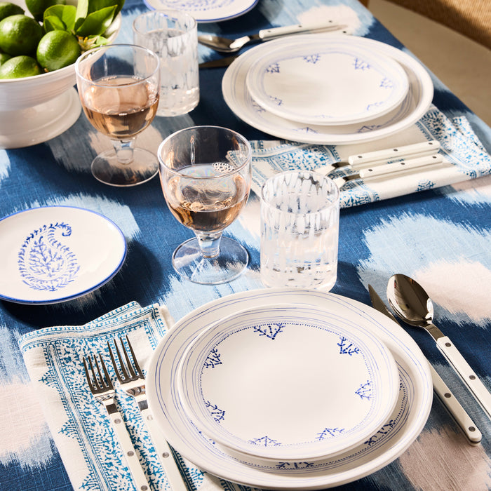 Peter Dunham + Hudson Grace Blue Hand-Painted Kashmir Paisley Appetizer Plate on a patterned blue tablecloth.