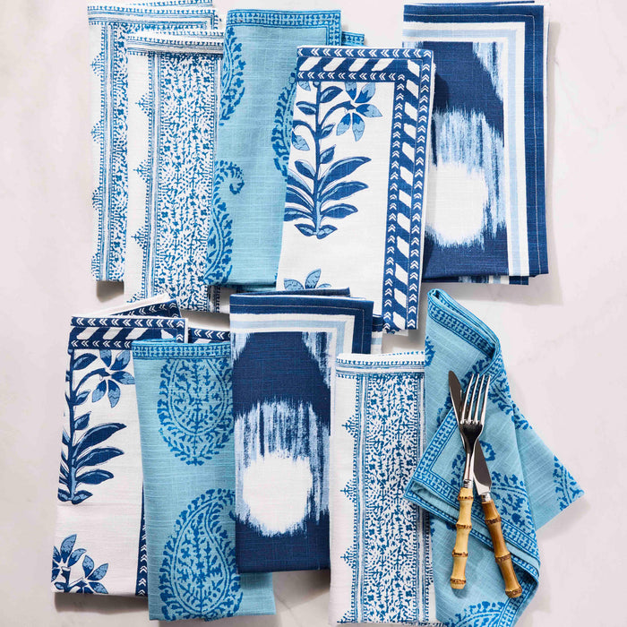 Peter Dunham + Hudson Grace Blue Shani Floral Printed Napkin, 100% cotton slub, with various blue botanical patterns.