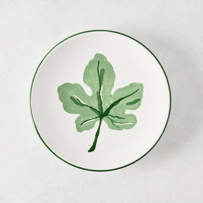 Peter Dunham + Hudson Grace hand-painted white appetizer plate with a green fig leaf and green border.