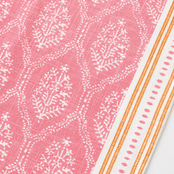 Peter Dunham pink cotton slub table runner with white Jaali floral block print and orange striped border.