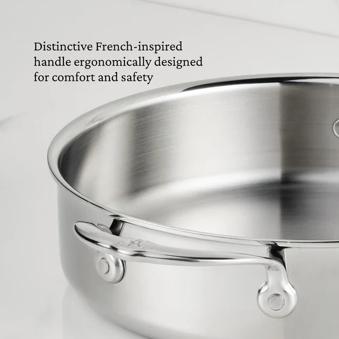 A close-up of a ProBond Luxe® Polished Clad Stainless Steel Rondeau with Lid on a white surface, highlighting its elegantly curved handle. Text on the image describes the handle as French-inspired and ergonomically designed for comfort and safety.