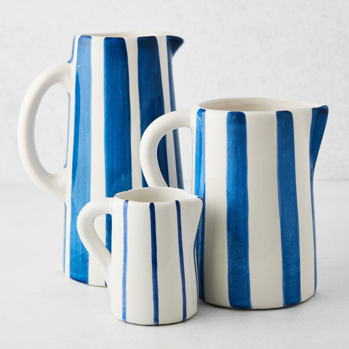 Portofino Blue Stripe Small Ceramic Pitcher, white with hand-painted blue stripes, curved handle and spout.