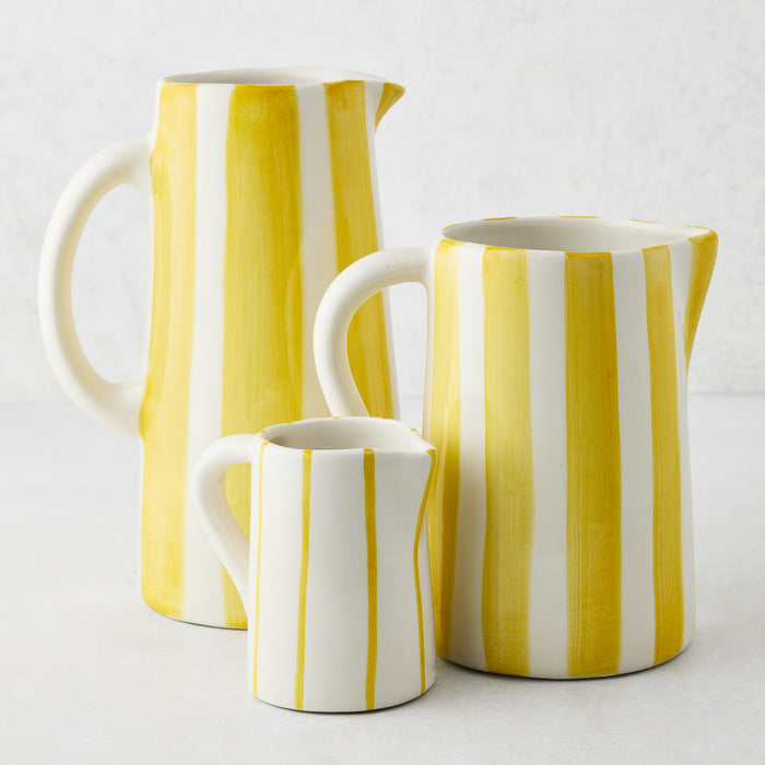 Portofino Yellow Stripe Large Ceramic Pitcher, white with hand-painted yellow vertical stripes, curved handle and spout.