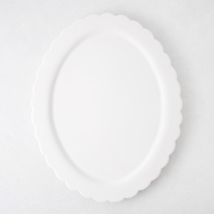 White ceramic Scallop Oval Serving Platter, 17.72"L x 14.17"W, with a scalloped edge.