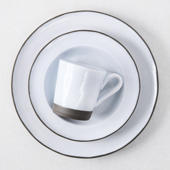 Smoke grey stoneware soup bowl with two-toned glaze, light grey smooth top, dark grey coarse bottom.
